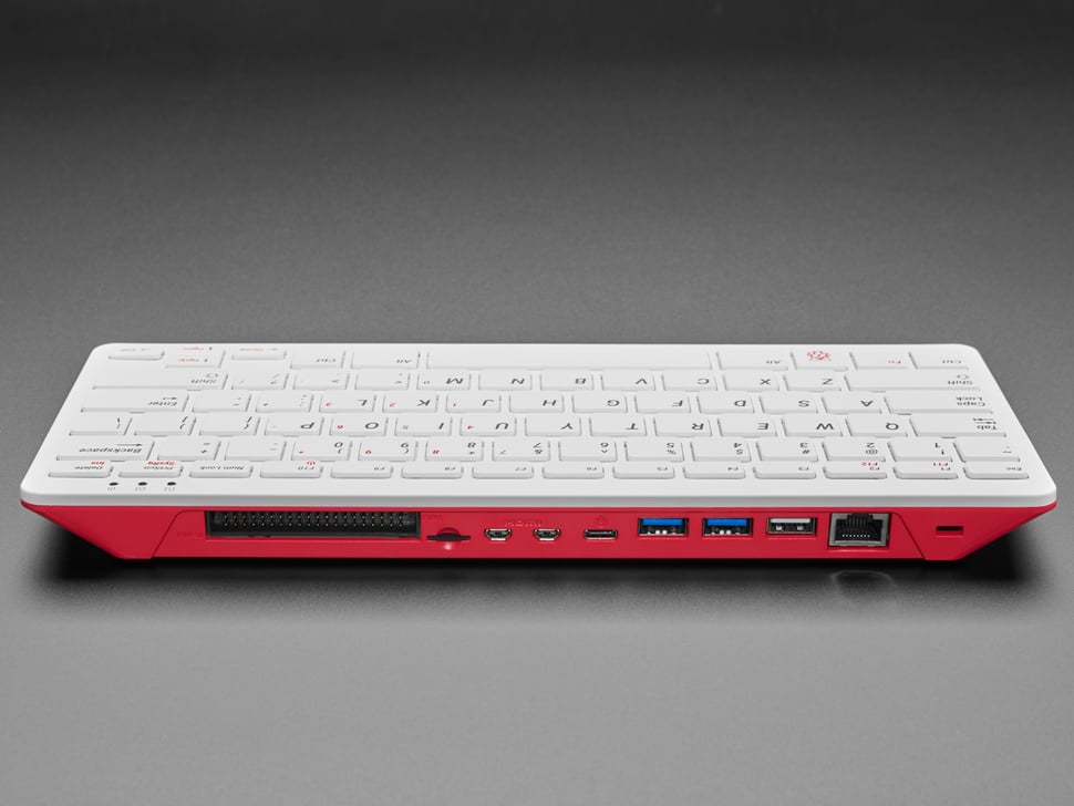 The back edge of the Raspberry Pi 400 showing its two micro-HDMI ports, USB ports and Ethernet socket